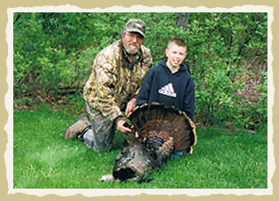 Darrell and his grandson go turkey hunting together